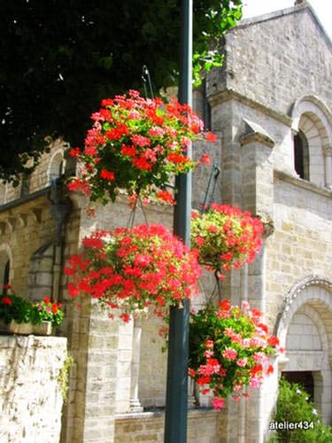 Flowers display by Eglise St. Martin in Caniac du Causse