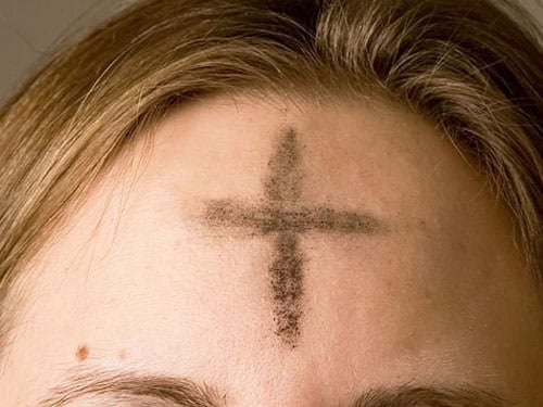 Cross of ashes on Palm Sunday