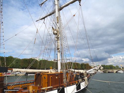 A three-masted schooner moored downstream from Pont des Invalides