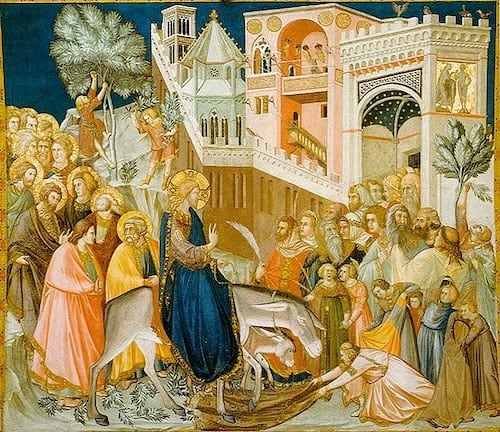Jesus makes his triumphal entry into Jerusalem