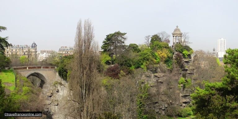 The Parc des Buttes Chaumont stands as the third largest public park in Paris, sprawling across a hill once known as Mont Chauve (barren hill) in the iconic district of Belleville