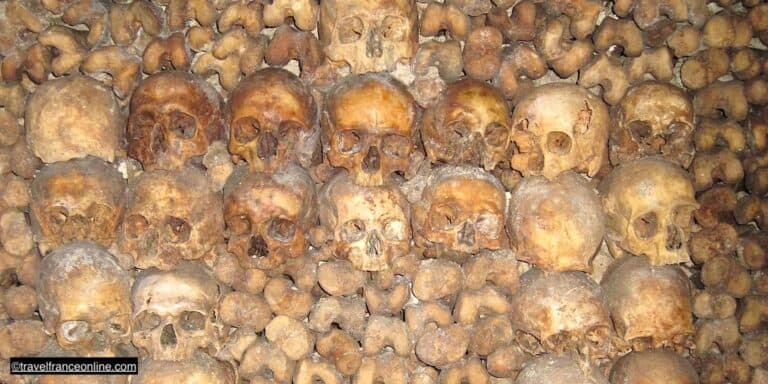 The Catacombes, Paris underground necropolis, a labyrinth of galleries lined with small crypts holding over six million skeletons, the remains of generations of Parisians.